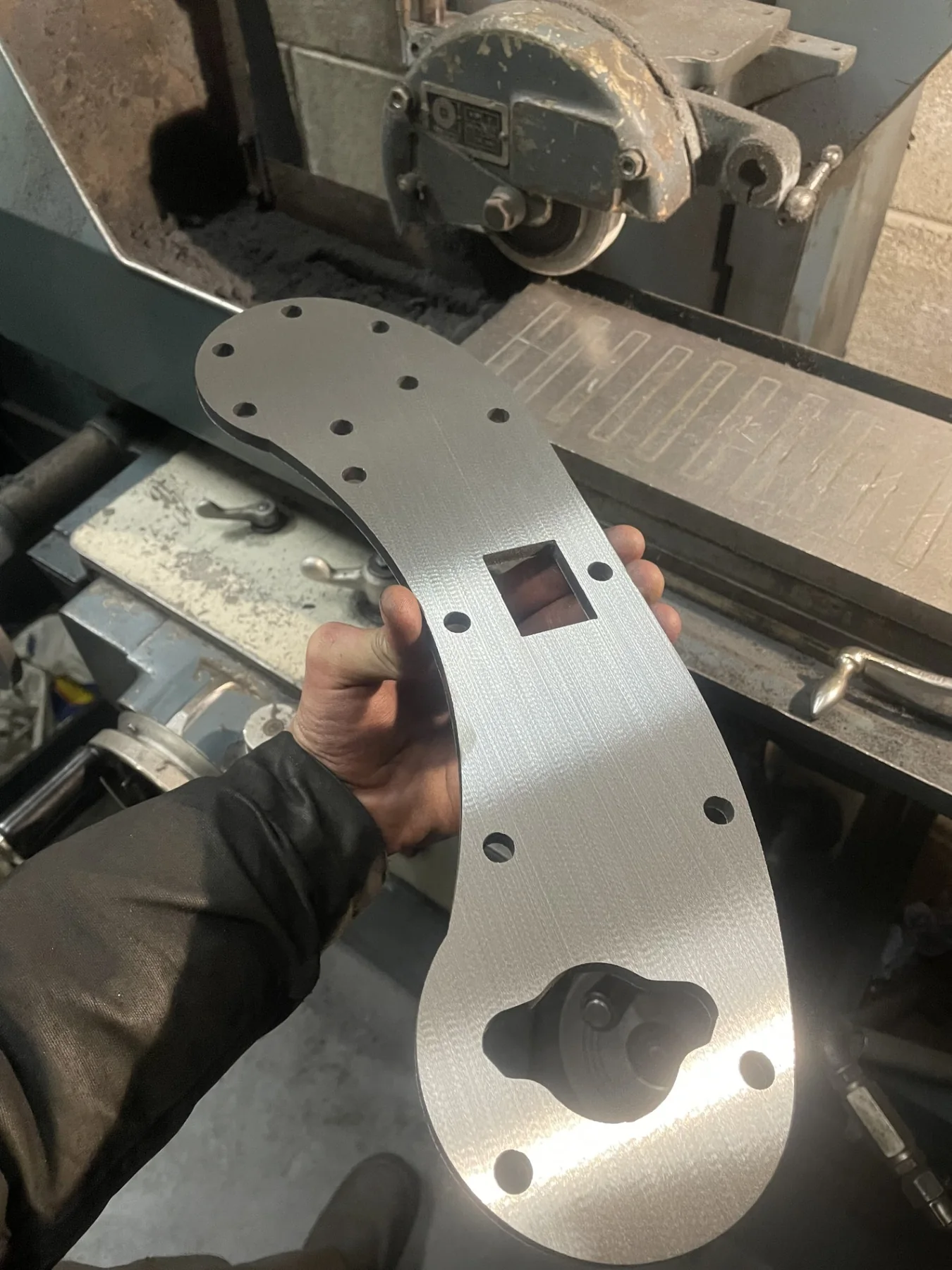 Machined metal plate in a workshop
